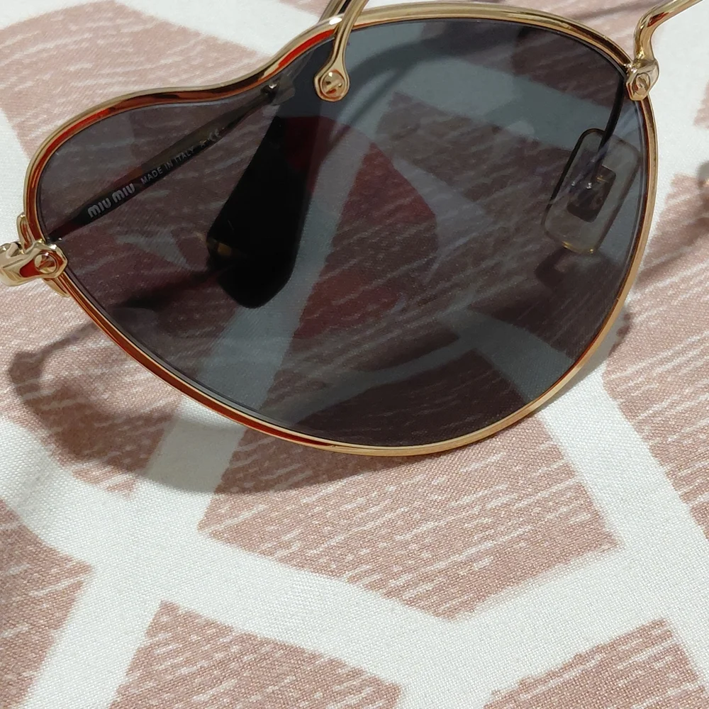 Miu Miu Gold Frame Sunglasses with Black Lenses